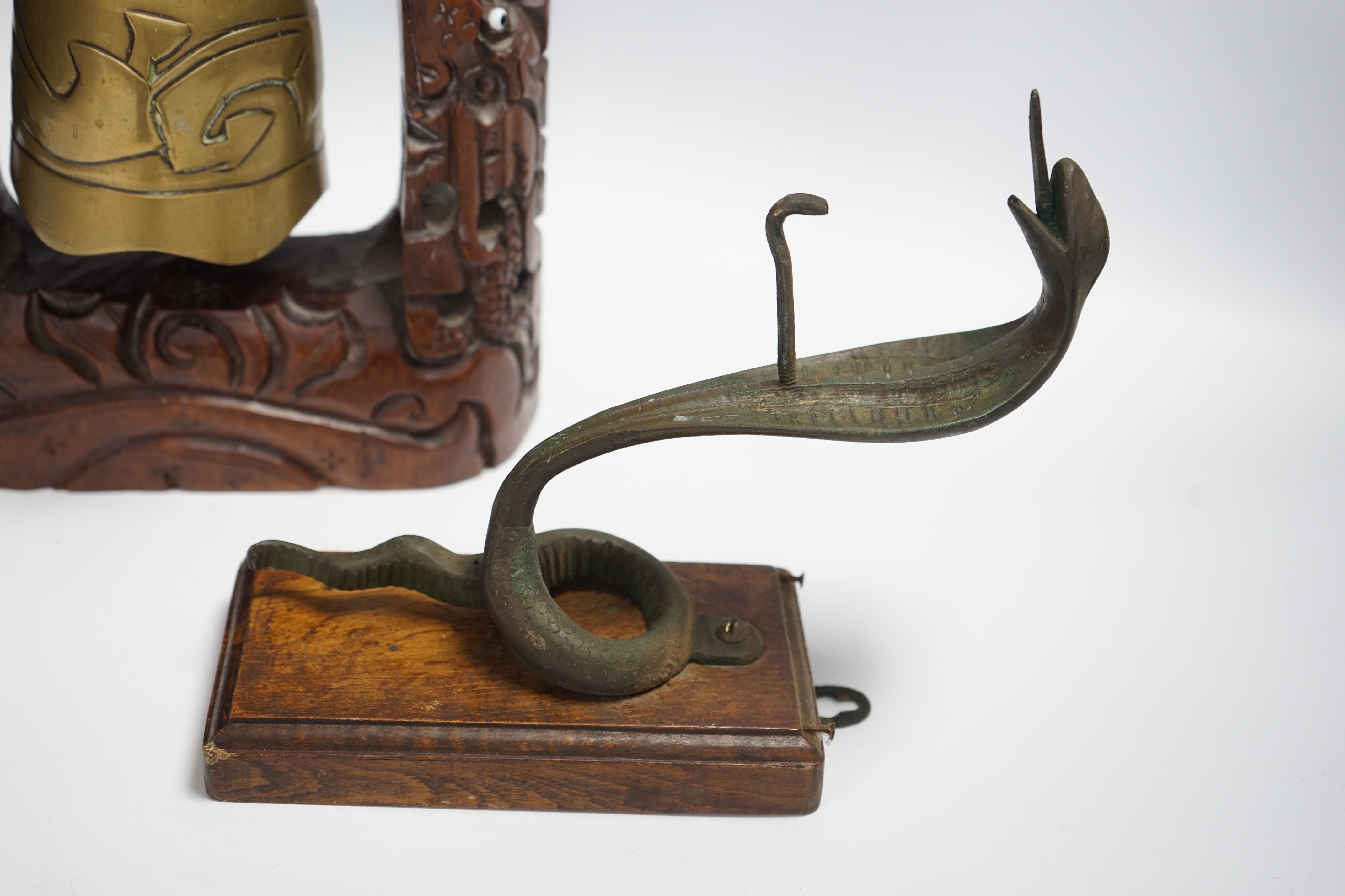 A Chinese table bell, pewter tea canister and an Indian ‘cobra’ hook, bell in frame 34.5cm high